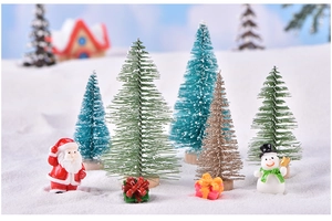 Mini sisal Christmas trees and resin figurines in a snowy micro landscape scene