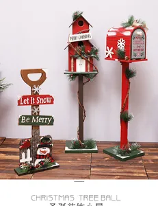 Three-piece wooden Christmas decor set featuring a snowman shovel, birdhouse, and mailbox