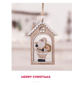 Detail of wooden Christmas house ornament featuring Santa Claus and warm bokeh background