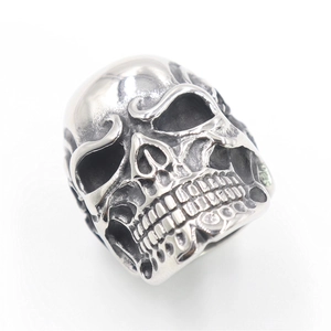 Close-up of vintage style silver skull ring with detailed antique finish metalwork