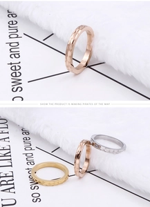 Detail of hammered texture on slim titanium steel rings in gold silver and rose gold