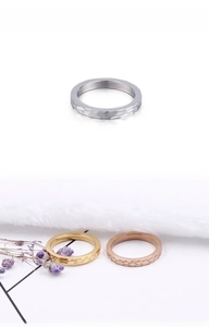 Detailed view of hammered texture titanium steel rings in silver, gold and rose gold