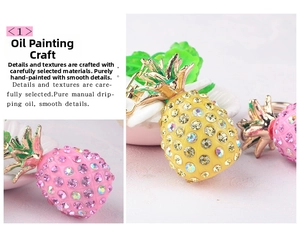 Detail view of handmade enamel pineapple keychain featuring multi-color sparkling rhinestones