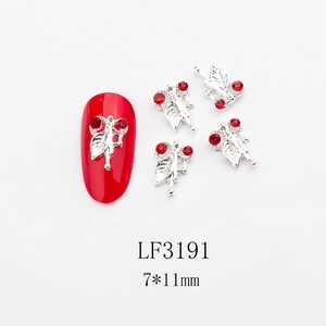 Detailed macro view of LF3191 nail art charms with red rhinestones and silver leaves