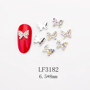 Macro shot of 6.5x8mm butterfly nail art charms with AB crystals and silver alloy base