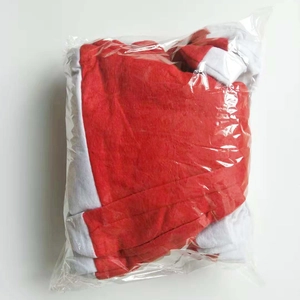 Close-up of a red and white Christmas hat packed in a transparent protective polybag