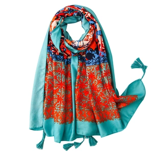 Bohemian lake blue oversized silk scarf with red floral patterns and tassel details
