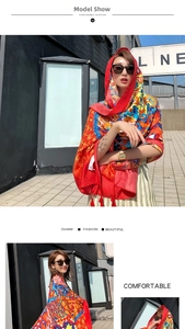 Detail of vibrant red ethnic print silk shawl with bohemian geometric flower patterns