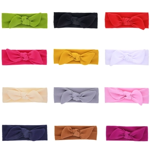 Set of 12 waffle texture baby headbands with large bows in assorted vibrant colors