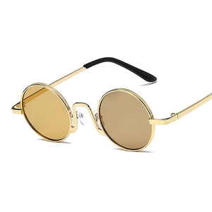 Retro round metal sunglasses with amber lenses and golden frames shown from 45-degree angle