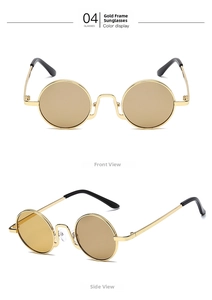 Detail view of vintage round gold metal frame sunglasses with tea lenses and thin temples