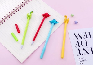 Close-up of cute cartoon dinosaur gel pens in various colors with 3D soft toppers