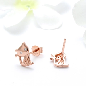 Detailed view of rose gold cat stud earrings showing 925 silver hallmarks and cubic zirconia