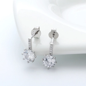 Close-up of S925 sterling silver earrings with clear zircon stones and hallmark detail