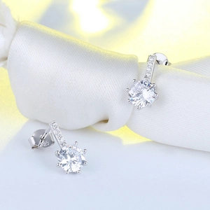 Macro shot of S925 sterling silver stud earrings featuring round cubic zirconia in claw setting