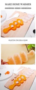 Detailed view of 3-hole sphere rice ball mold and white mini spatula on wooden board