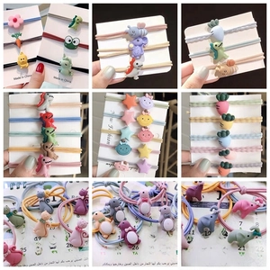 Macro shot of assorted colorful resin cartoon charms for DIY crafts and hair accessories