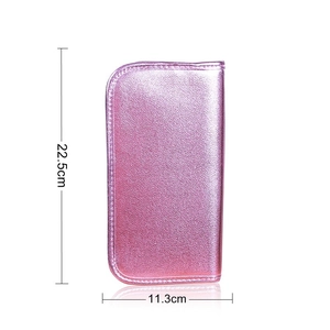 Pink metallic makeup brush bag measuring 22.5cm by 11.3cm with fine textured finish