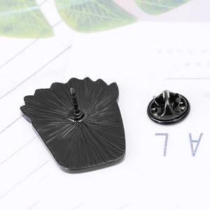 Black enamel succulent badge back view with anti-slip texture and metal clutch pin