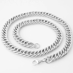 Detailed view of silver Cuban link chain necklace with high polish finish and lobster clasp