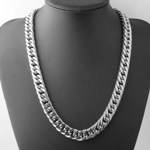 Silver chunky double-link chain necklace displayed on a black mannequin bust for men