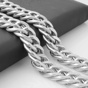 Detailed macro view of thick silver Franco chain showing woven metal link texture