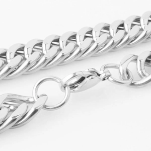 Close-up of silver Cuban link chain featuring a secure lobster clasp and polished finish