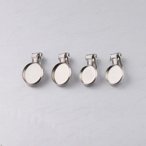 Detail of four 10mm silver stainless steel ear clips for non-pierced DIY jewelry making