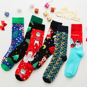Detailed flat lay of five assorted cotton Christmas socks with festive holiday patterns
