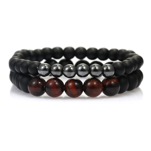 Mens beaded bracelet set with matte black hematite and natural tiger eye stones on white background