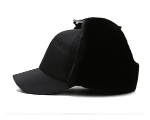Detail view of winter trapper hat with thick black faux fur lining and windproof fabric