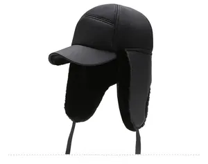 Detail of warm black trapper hat featuring thick thermal lining and windproof ear flaps