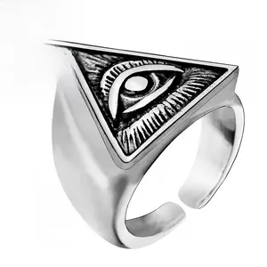 Detailed macro view of the punk Eye of Providence engraving on the silver ring