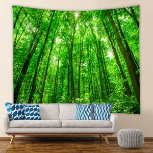 Detail of vibrant green forest tapestry hanging on a modern living room wall