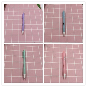 Detail of four colorful pastel mechanical pencils arranged in a 2x2 grid pattern