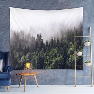 Detailed view of bohemian forest tapestry hanging in a modern living room setting