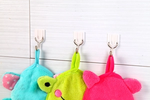 Strong white plastic hooks on tile wall holding microfiber towels in various colors