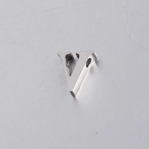 Macro shot of 10mm mirror polished stainless steel letter V bead with threading hole