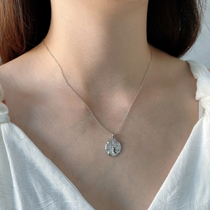 Detailed view of 925 sterling silver necklace with a vintage coin relief pendant