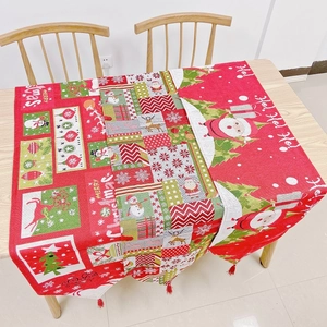 Detailed close-up of festive Christmas table runner featuring Santa and reindeer patterns