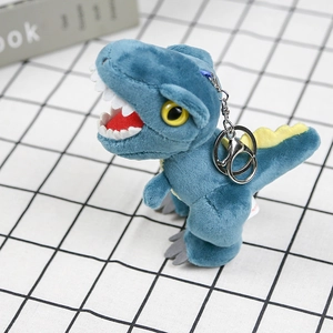 Close-up of blue plush T-Rex keychain with yellow eyes and silver metal hook
