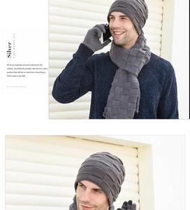 Detailed view of men's winter knitted three-piece set with grey beanie, scarf and gloves