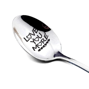 Polished stainless steel long handle spoon engraved with Love You More heart pattern