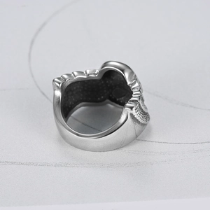Stainless steel skull wing ring showing the silver inner honeycomb texture and band structure
