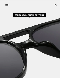 Close-up of integrated comfortable nose support on sleek black oval sunglasses