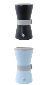 Detail view of electric pet paw cleaners in black and blue with circular power buttons
