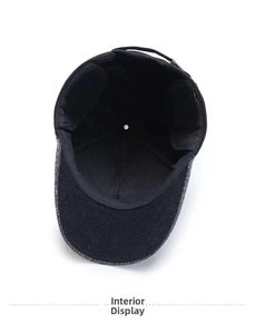 Detail view of the warm black fleece lining and foldable ear flaps on wool baseball cap