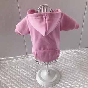 Detailed view of pink cotton pet hoodie with kangaroo pocket on a white metal mannequin