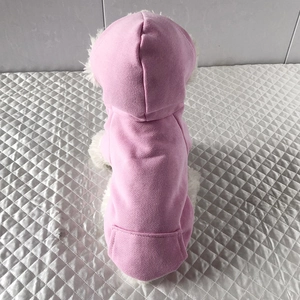 Pink pet hoodie with white faux fur trim on hood shown from a back view macro perspective