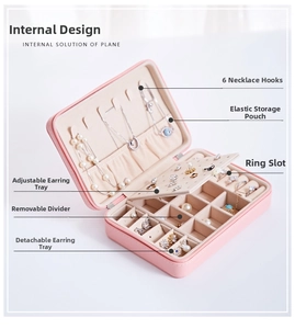 Internal layout of pink jewelry box with necklace hooks and adjustable compartments